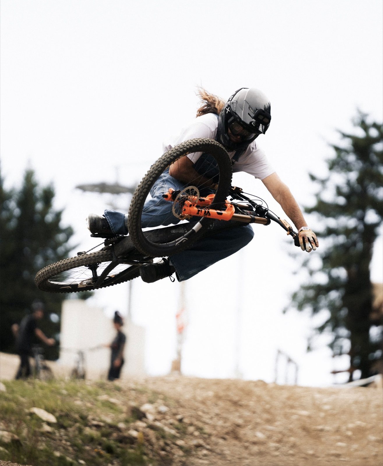 Rider whipping a jump at a bike park