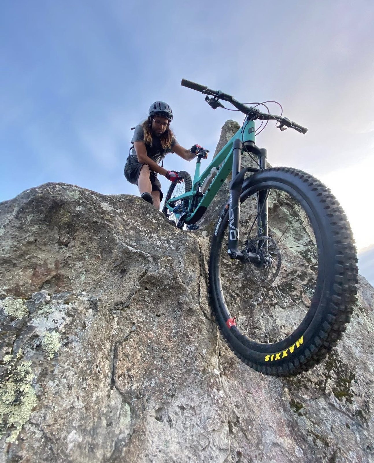 Rider climbing a rock feature