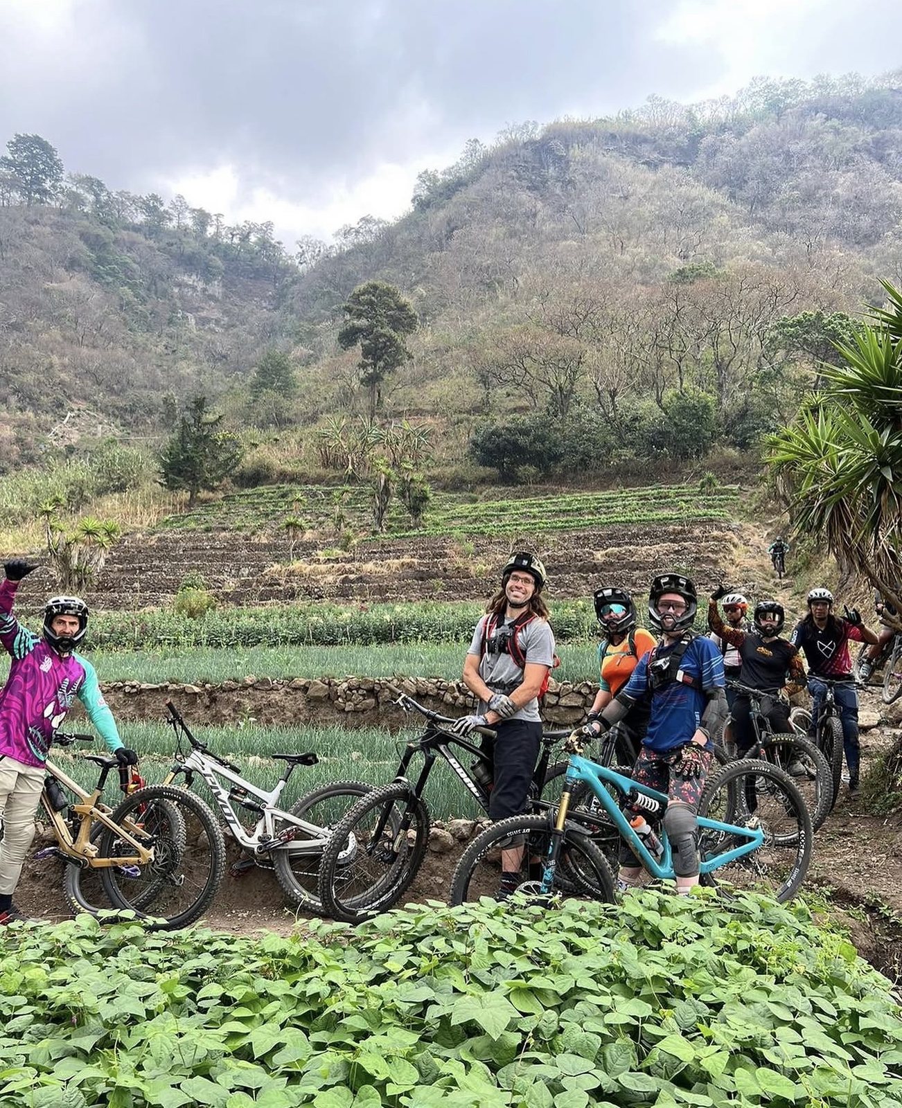 Mountain bike clinic group above terraced fields in Guatemala